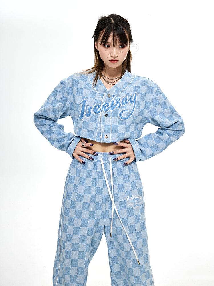 ICIC CHECKER cropped denim baseball jacket, front styling with hands at the waist