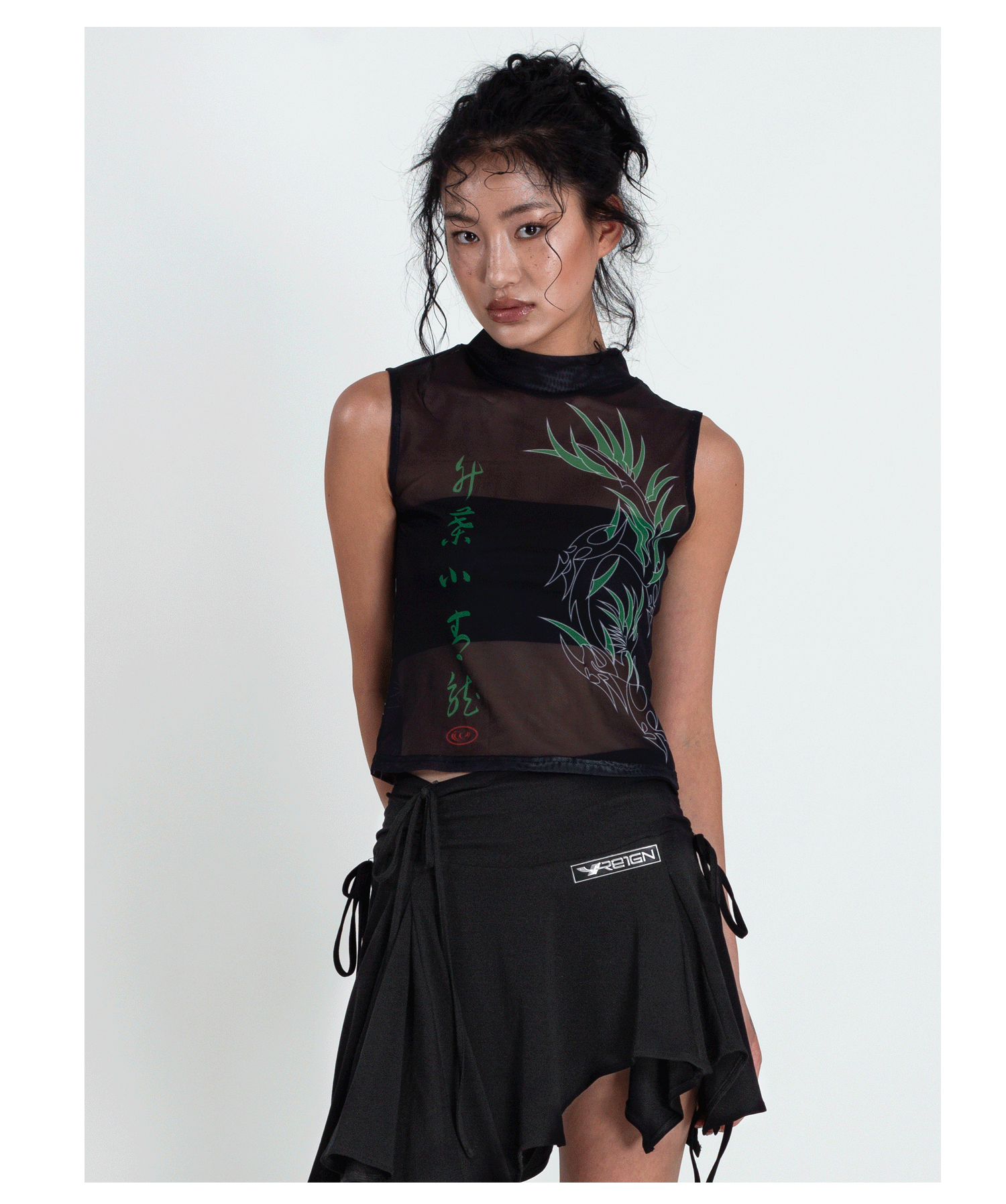 4RE1GN BAMBOO DRAGON sleeveless mesh vest, front pose with hands behind the back