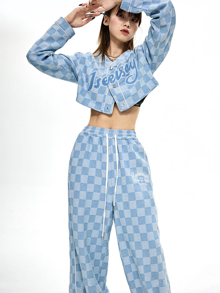 ICIC CHECKER cropped denim baseball jacket, front styling with arms raised