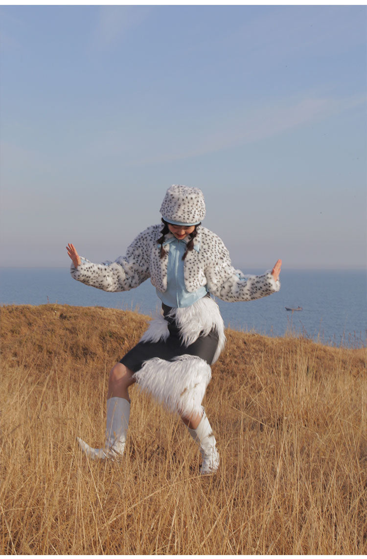 NEXT PASSPORT FUR FUR reversible bucket hat / bag, distant full hat styling in a grassy landscape