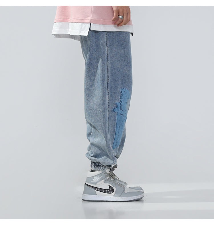 BJHG EMBROIDERED loose denim joggers, close side styling showing the gathered cuff