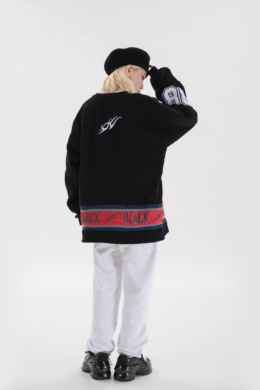 BLACKAIR varsity-letter sweatshirt, black, rear pose touching hair
