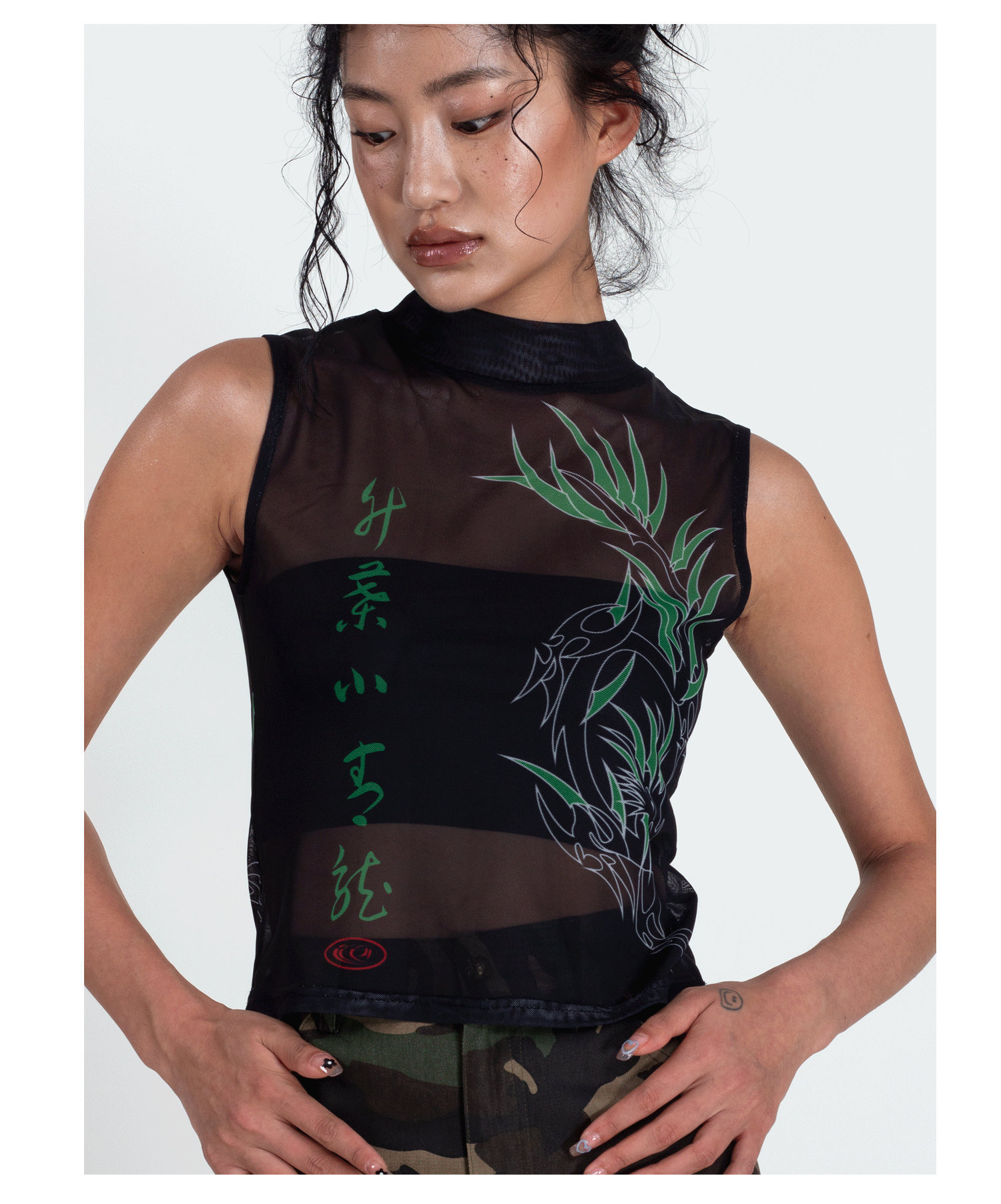 4RE1GN BAMBOO DRAGON sleeveless mesh vest, close front-side pose with hands at the waist