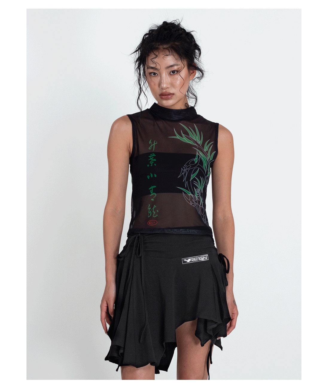 4RE1GN BAMBOO DRAGON sleeveless mesh vest, straight front pose with a black skirt