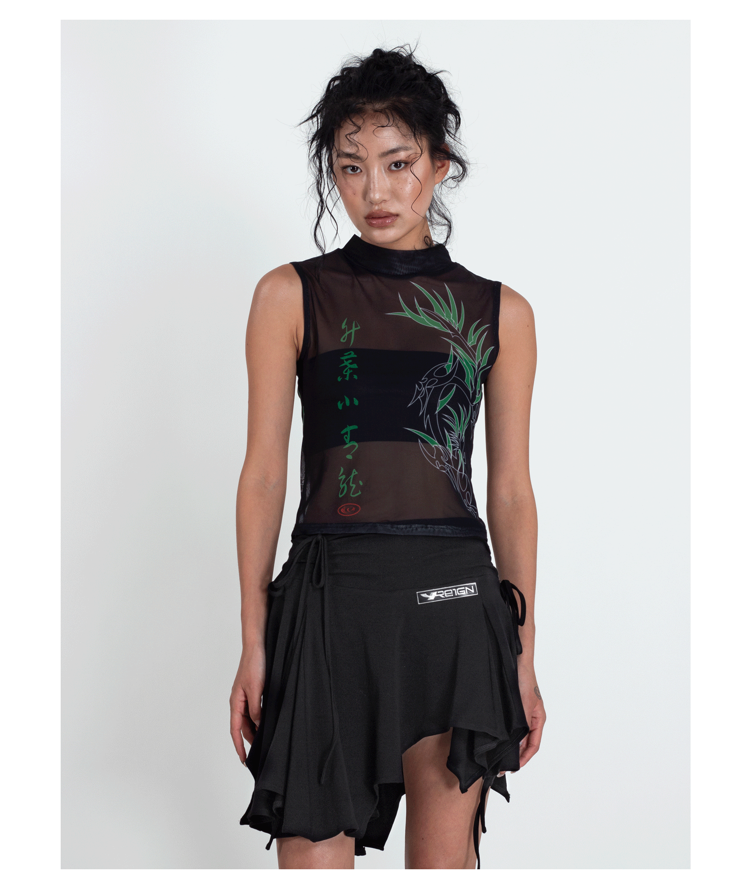 4RE1GN BAMBOO DRAGON sleeveless mesh vest, straight front pose with a black skirt