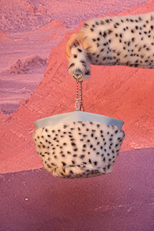 NEXT PASSPORT FUR FUR reversible bucket hat / bag, close-up of the chain-handled spotted bag