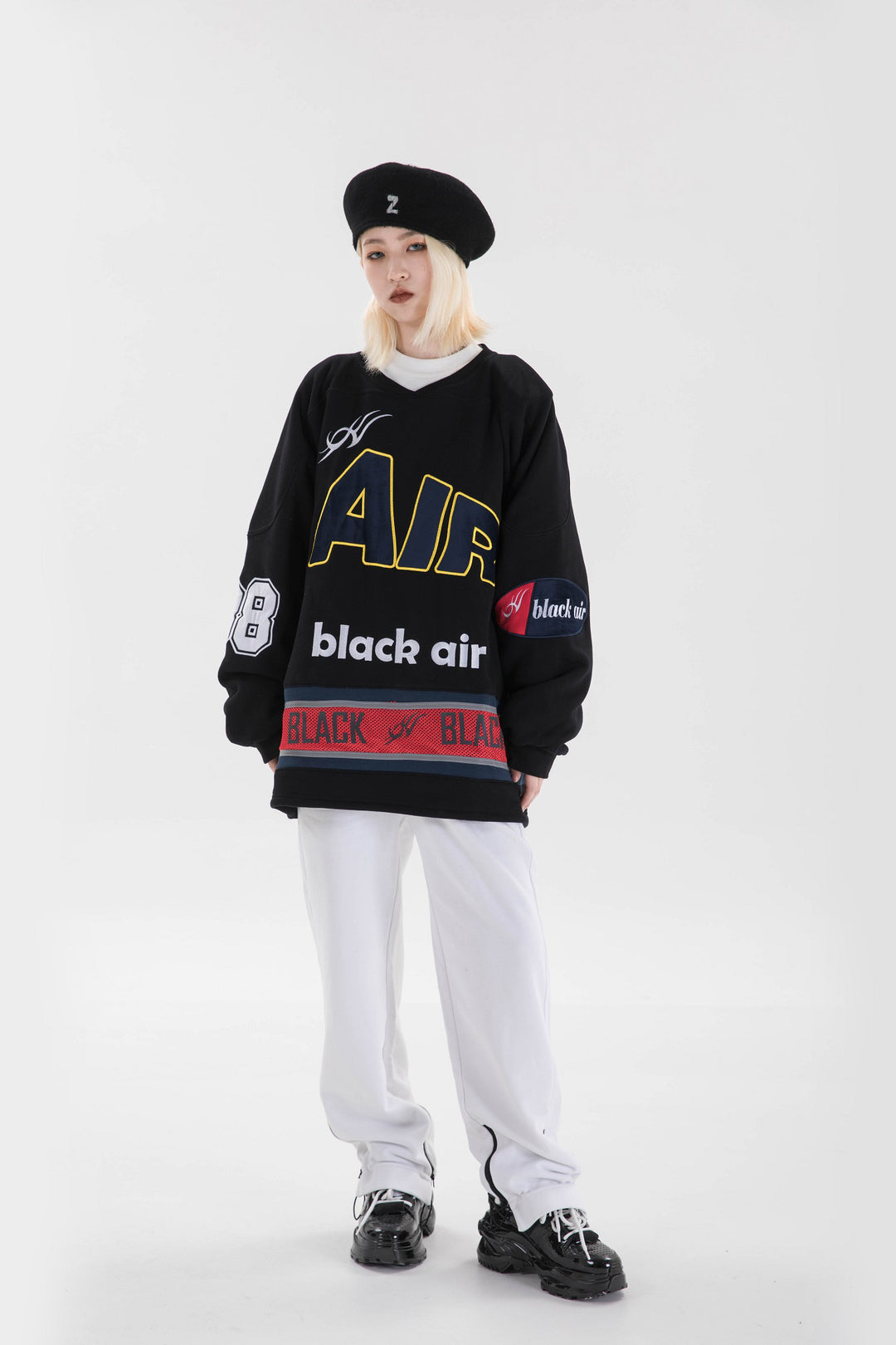 BLACKAIR varsity-letter sweatshirt, black, full standing pose looking sideways
