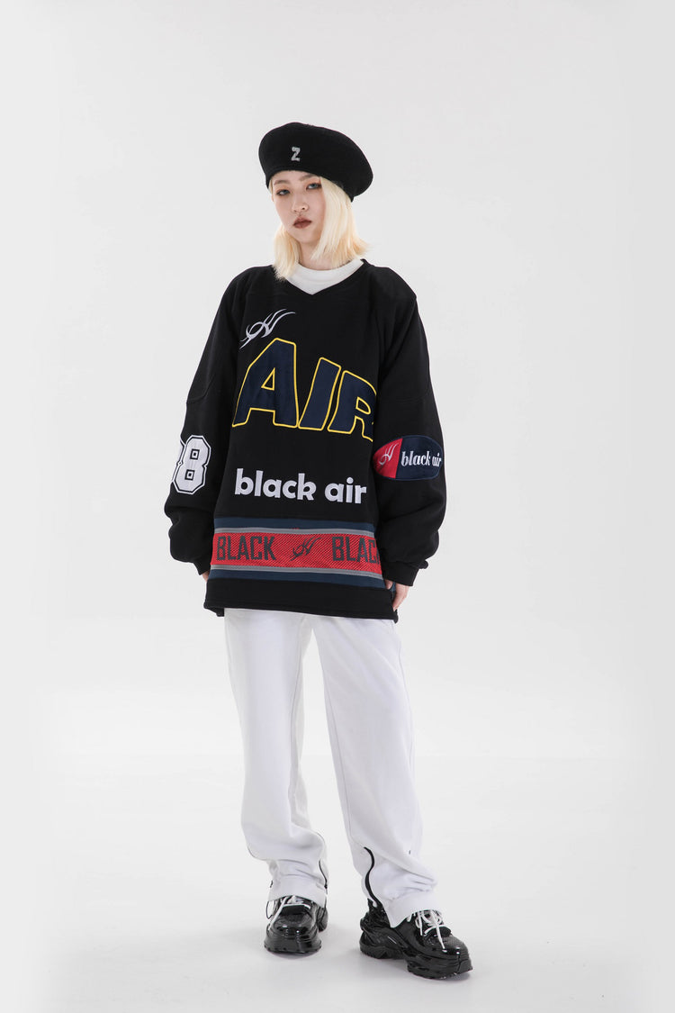 BLACKAIR varsity-letter sweatshirt, black, full standing pose looking sideways