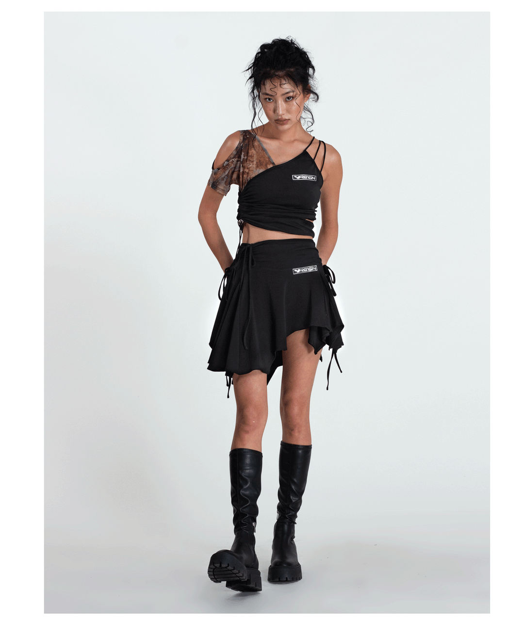 4RE1GN TIE-DYE SLEEVE asymmetric crop top, full outfit with a hand at the waist