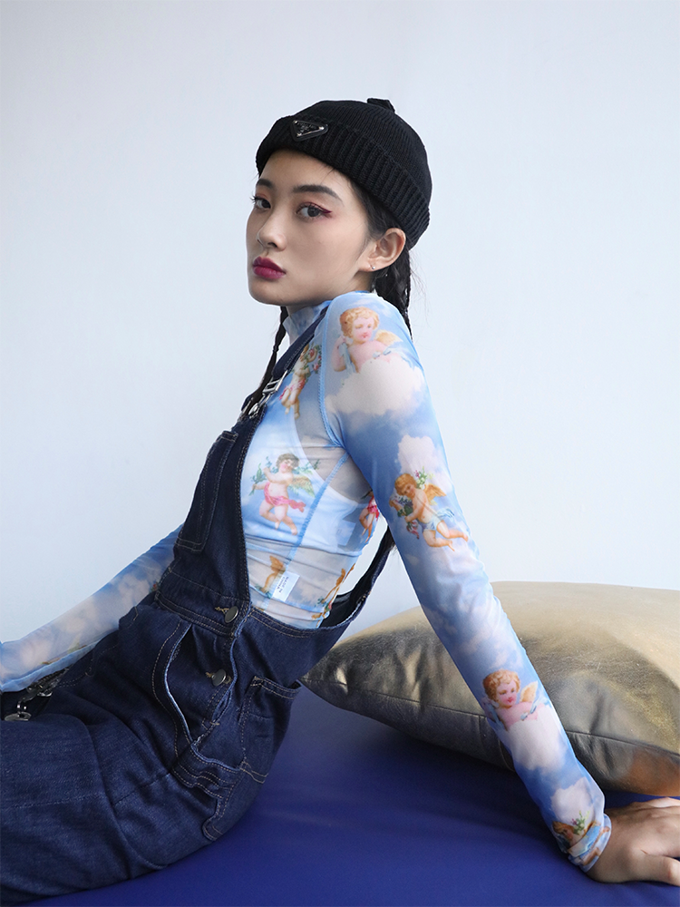 CLICK CHIC ANGEL cherub-print mesh crop top, seated side-front outfit