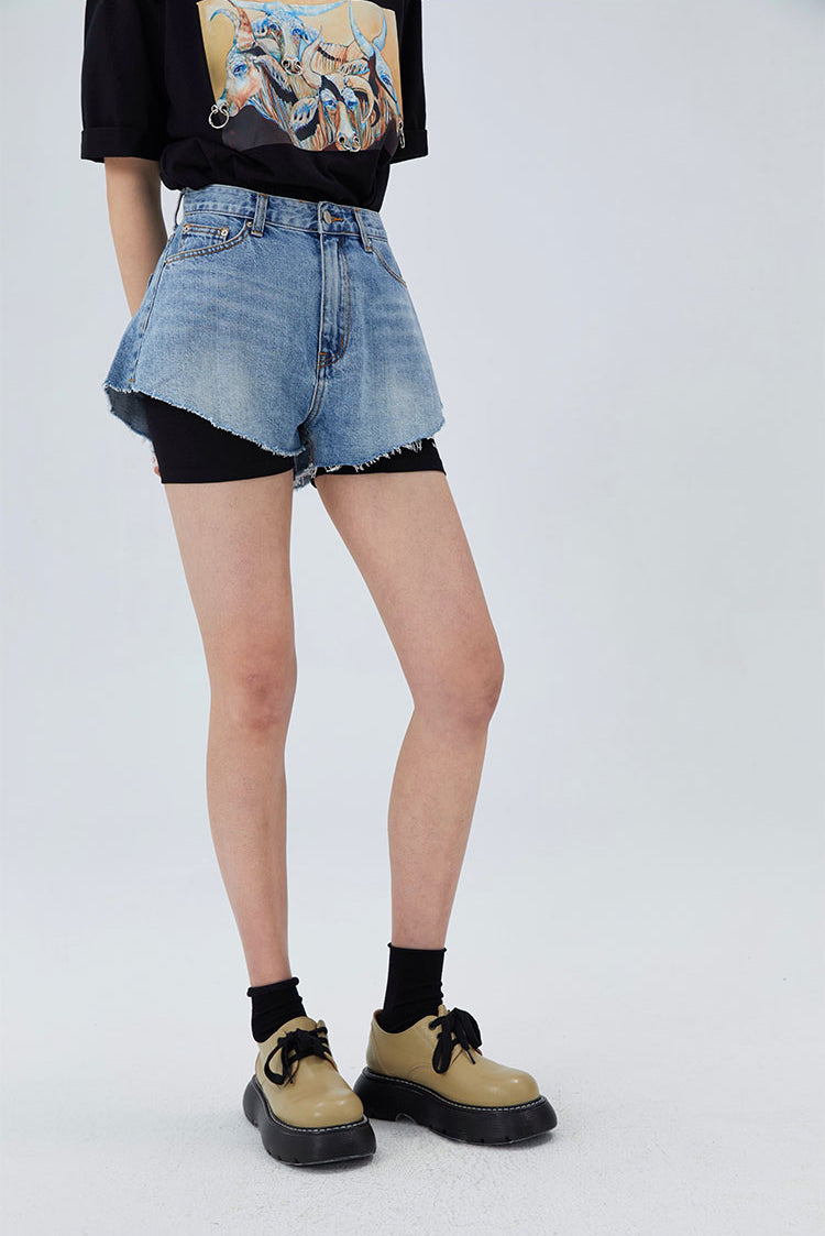 CLICK CHIC HACKWRENCH layered denim shorts, front three-quarter view over black biker shorts