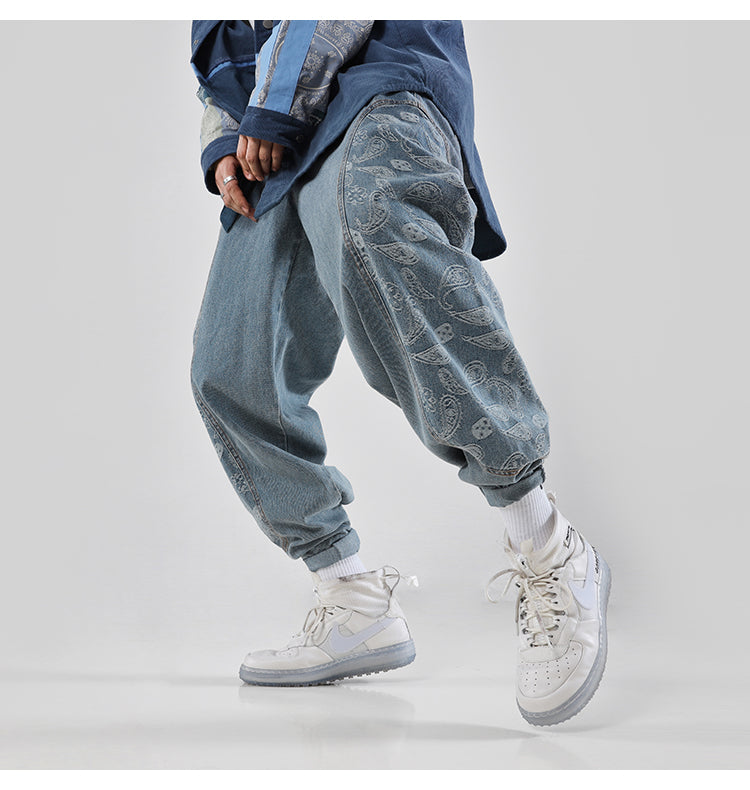 BJHG CASHEW paisley-panel loose jeans, stepping pose showing the wide legs