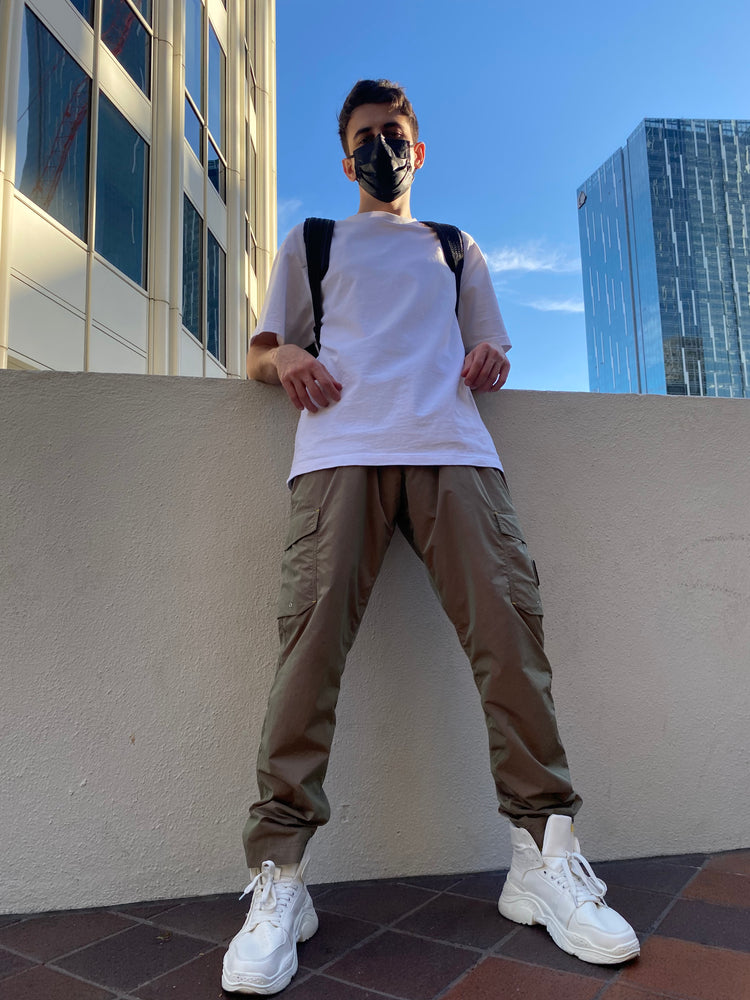 OFF-LABEL BASICS chunky high-top sneakers, white, full outdoor outfit against city skyline